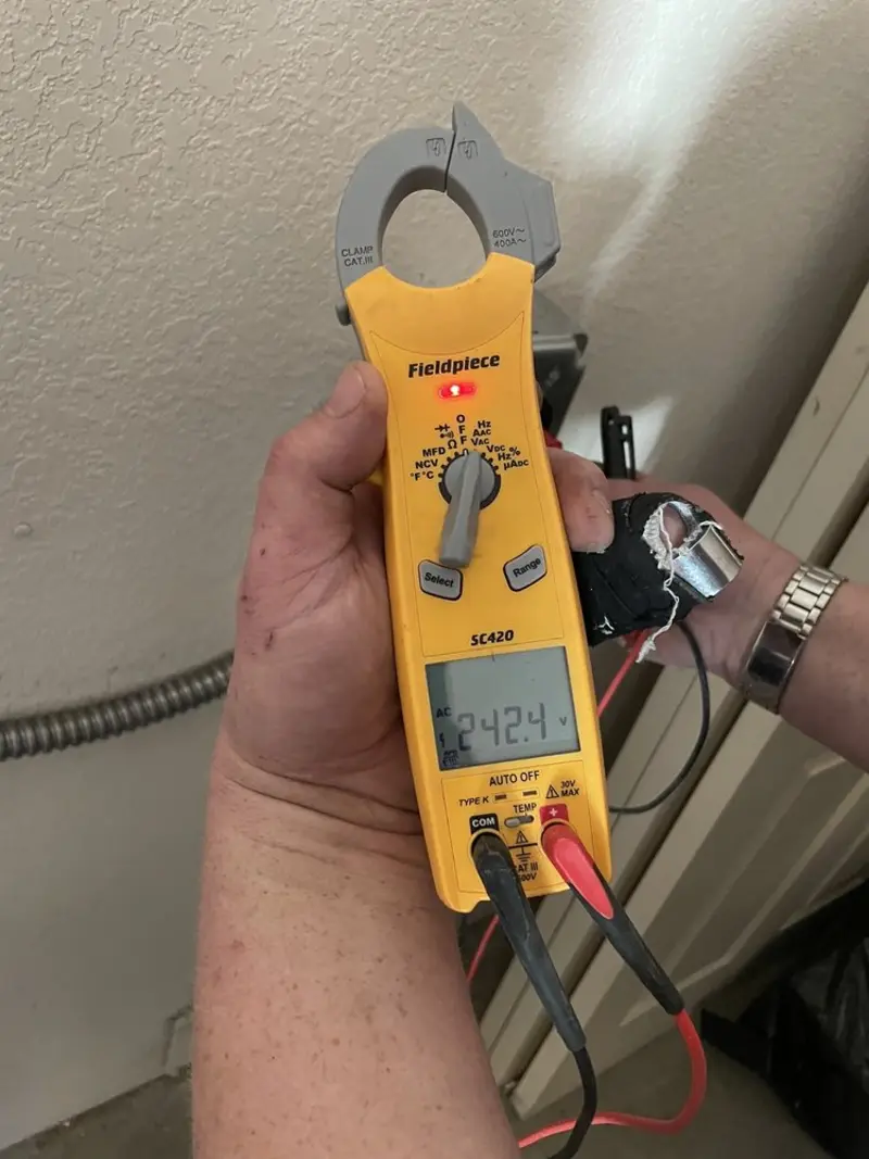 Voltage testing with clamp meter during Electrical Installation Services in Plumas Lake